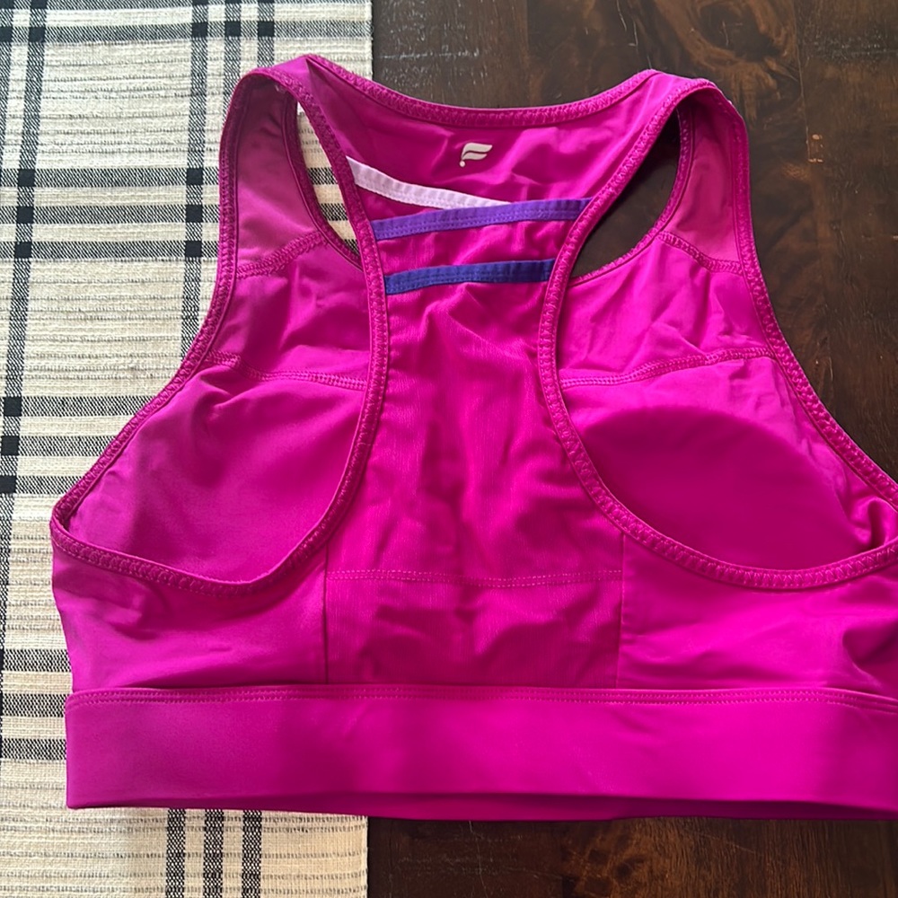 NWOT Fabletics bra top, magenta, size large.